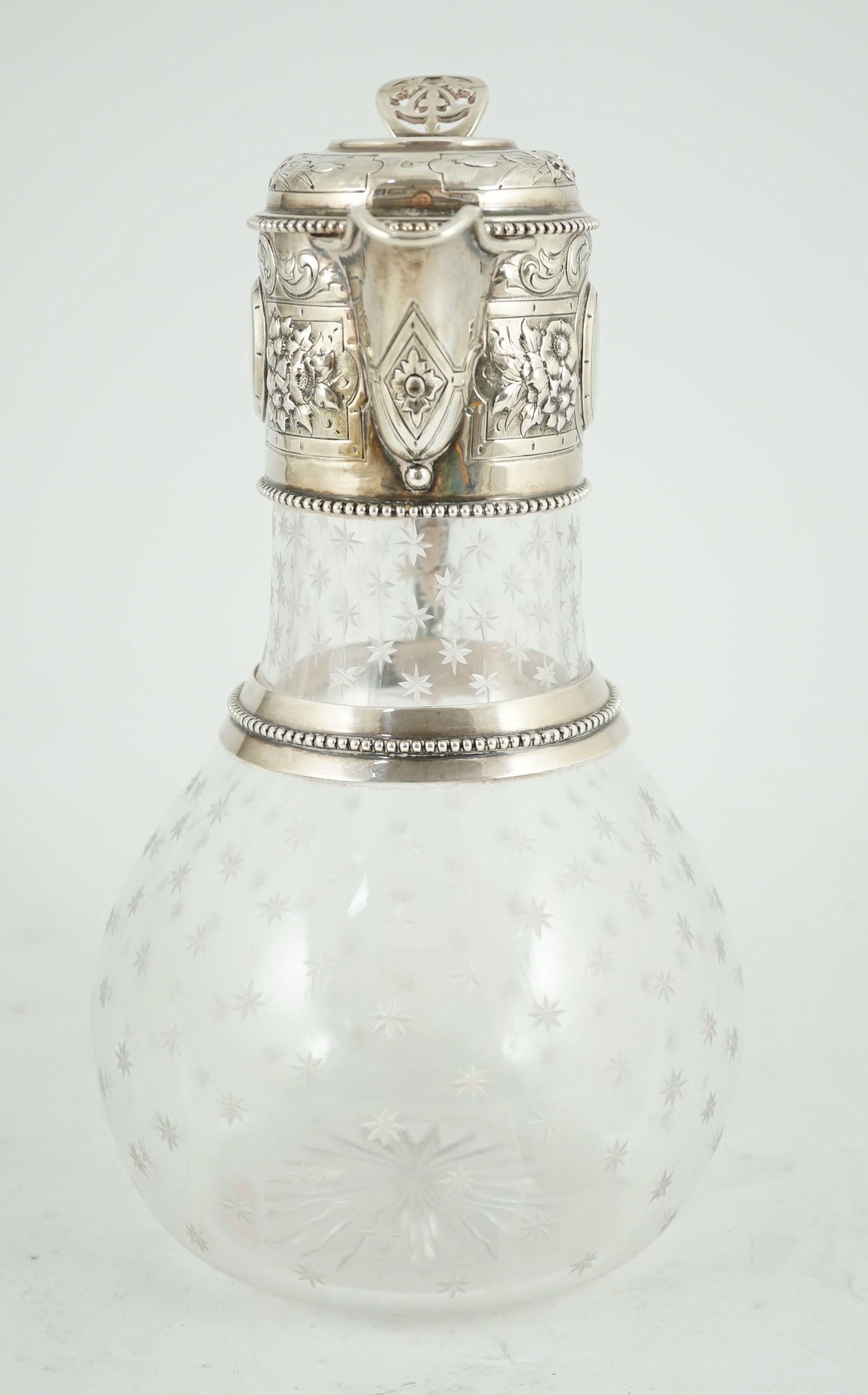 A Victorian embossed silver mounted engraved glass claret jug, the glass later, the silver, Sheffield, 1868, by William and George Sissons
